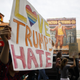 A demonstrator holds a ‘Love Trumps Hate’ sign during a protest in Los Angeles, California, on Saturday, Nov. 12, 2016. Patrick T. Fallon/Bloomberg via Getty Images